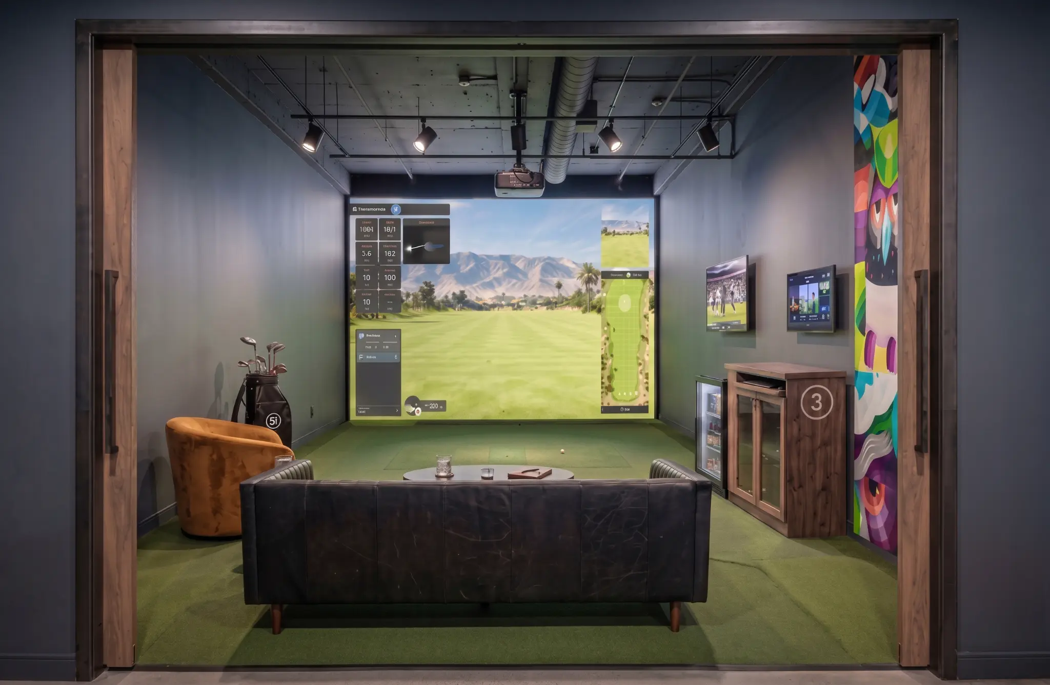 Private Five Iron Studio simulator bay with lounge seating and premium golf technology